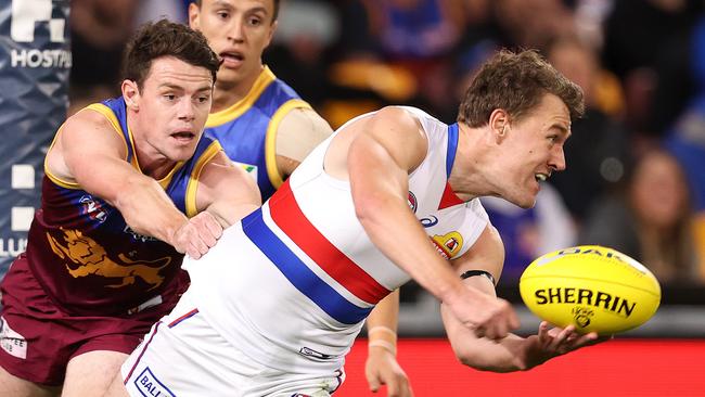 Jackson Macrae beats a Lachie Neale tackle in August this year. Picture: Michael Klein