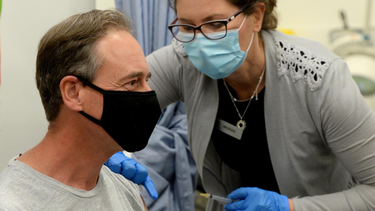 Federal Health Minister Greg Hunt receives the AstraZeneca vaccine at the Carrum Downs Respiratory Clinic. Picture: Andrew Henshaw