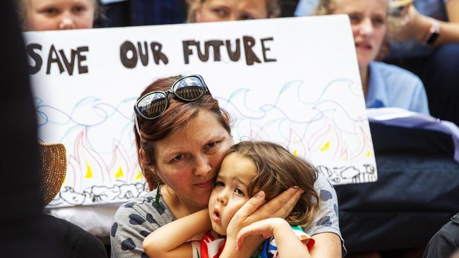 Mother and child at today’s Sydney protest. Picture: Jenny Evans