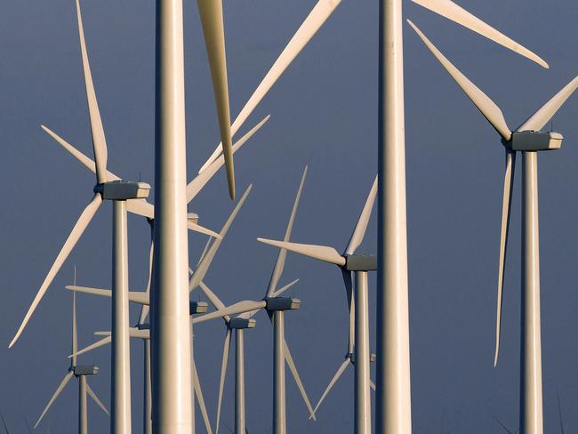 FILE - This May 6, 2013, file photo shows a wind turbine farm owned by PacifiCorp near Glenrock, Wyo. A group of Wyoming lawmakers is bucking the U.S. trend of supporting renewable energy with a plan to do the opposite: Fine utilities if they provide energy produced by wind or the sun. (AP Photo/Matt Young, File)