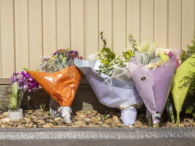 Floral tributes at the site. Picture: Jake Nowakowski