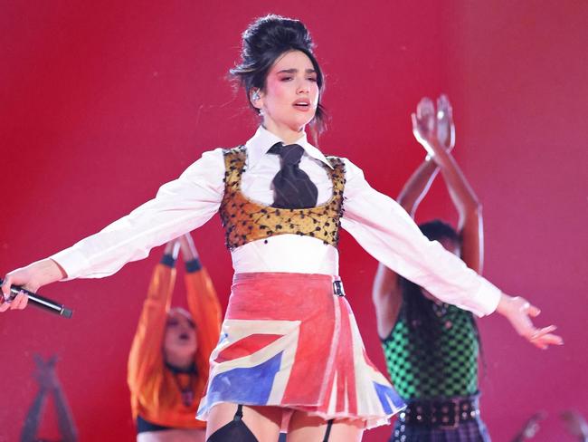 In a handout picture released by the Brit Awards English singer-songwriter Dua Lipa performs on stage at the BRIT Awards 2021 in London on May 11, 2021. (Photo by John Marshall / John Marshall / AFP) / RESTRICTED TO EDITORIAL USE â NO POSTERS â NO MERCHANDISEâ NO USE IN PUBLICATIONS DEVOTED TO ARTISTS - - NO ARCHIVE - NO SALES - NO USE AFTER **JUNE 8, 2021**