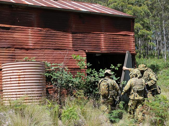 Task Force officers raid a remote bush shed near Tuggolo State Forest, close to Tamworth, during the massive manhunt for Naden.