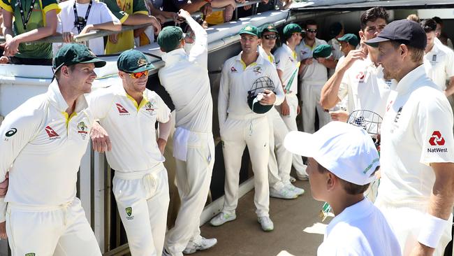 Australia and England players chat before play gets under way in Perth yesterday. There is no insinuation that any player involved in the match has been approached by match-fixing interests.