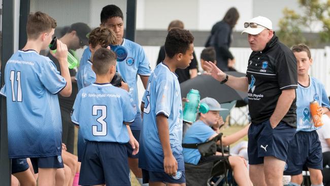 Springfield United under-13 Brisbane Youth Premier League coach Paul Waller shares his knowledge with some talented club players. Picture: Gary Reid