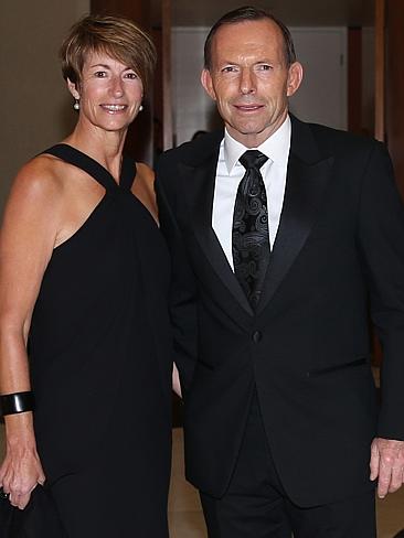 The Prime Minister Tony Abbott with his wife Margie, wearing a Simona black evening dress, arrive for the Mid Winter Ball. Pic by Gary Ramage