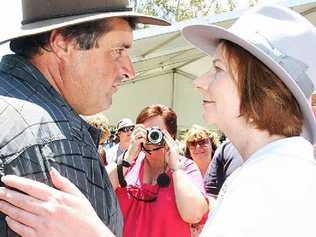 Prime Minister Julia Gillard greets a local at the Gatton commemorative flood service today. Picture: Rob Williams