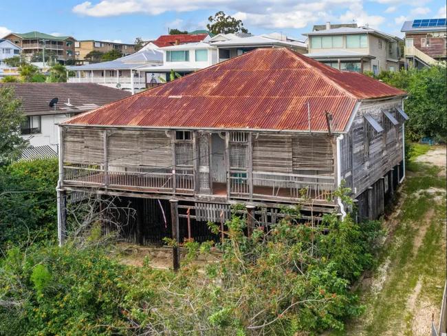 An uninhabitable heritage Queenslander home on an 810sq m block has lived up to pre-auction expectations when it changed hands for $2.005 million.