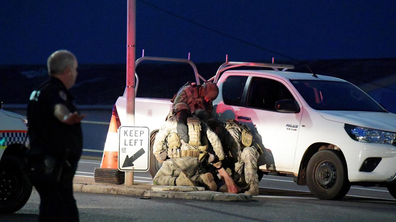 Ben Hoffmann is held down by police on the Daly Street bridge after killing four people in June 2019. Picture: Keri Megelus