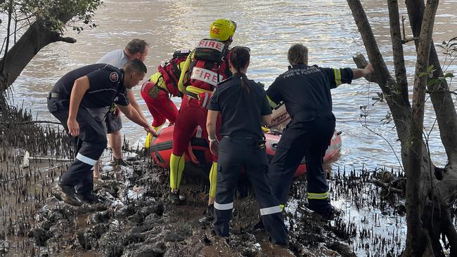 Emergency services entering the Brisbane River. Picture: Steve Pohlner