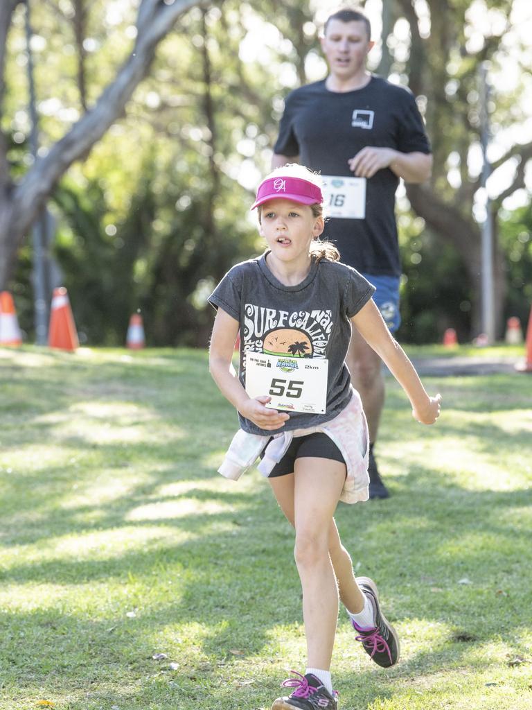 Maggie Wade finishes the 2km. Top of the Range adventure trail run at Picnic Point. Sunday, April 2, 2023. Picture: Nev Madsen.