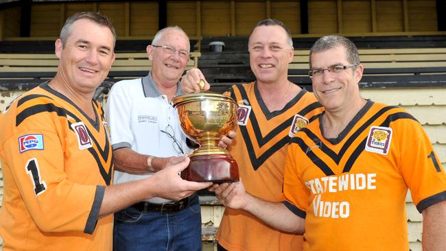 Gavin Payne, fair right, with other members of the Easts 1991 premiership side.