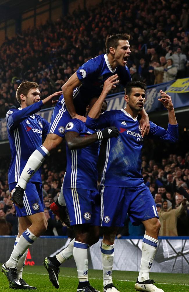 Chelsea's Brazilian-born Spanish striker Diego Costa (R) celebrates.