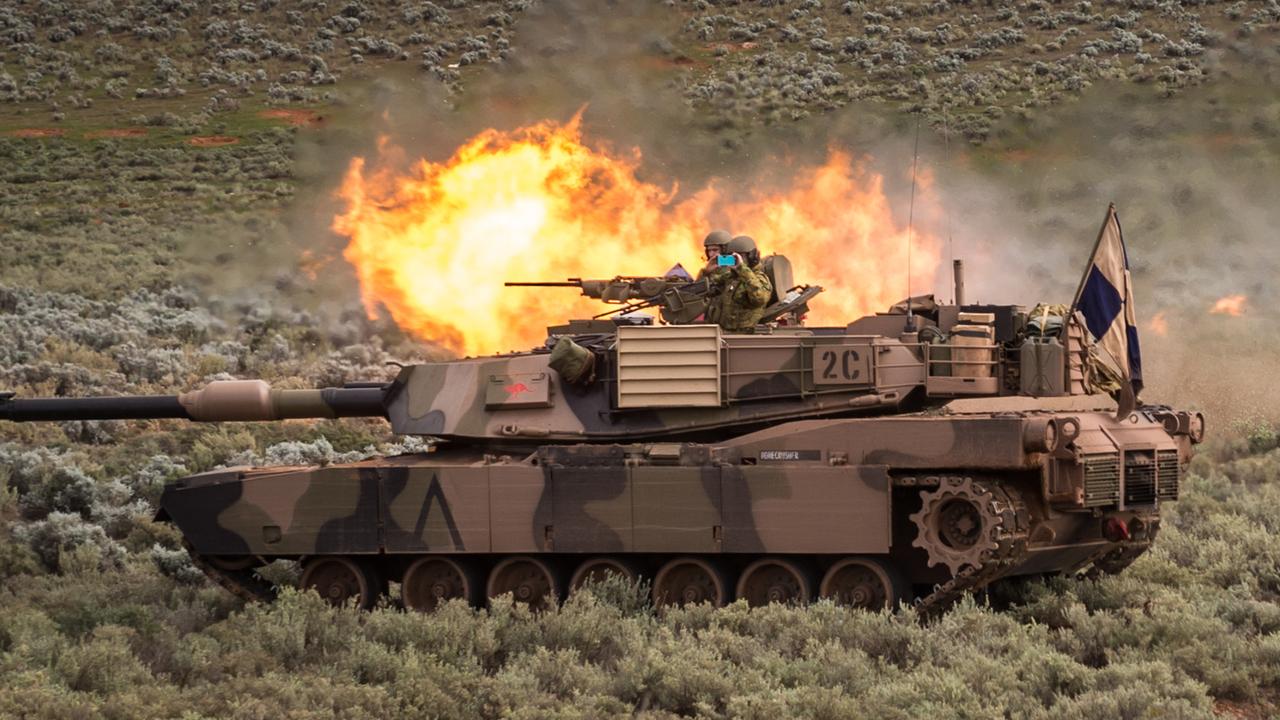 An M1A1 Abrams main battle tank of the 1st Armoured Regiment fires during Exercise Predators Strike at the Cultana Training Area, near Port Augusta.