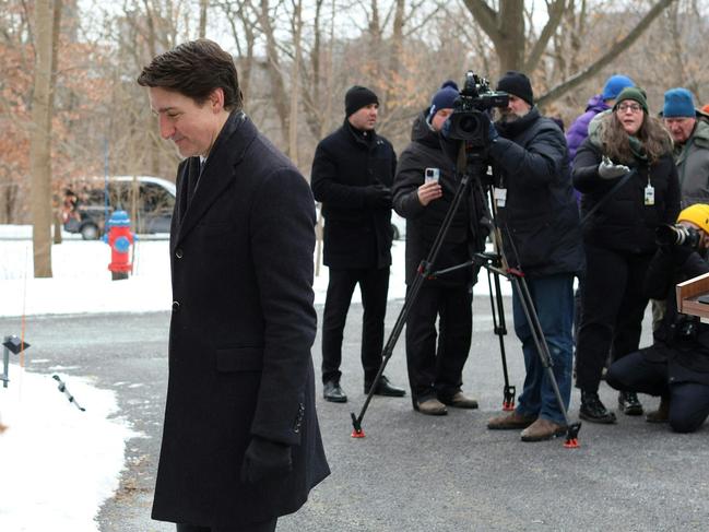 Canadian Prime Minister Justin Trudeau leaves after speaking at a news conference. Picture: AFP