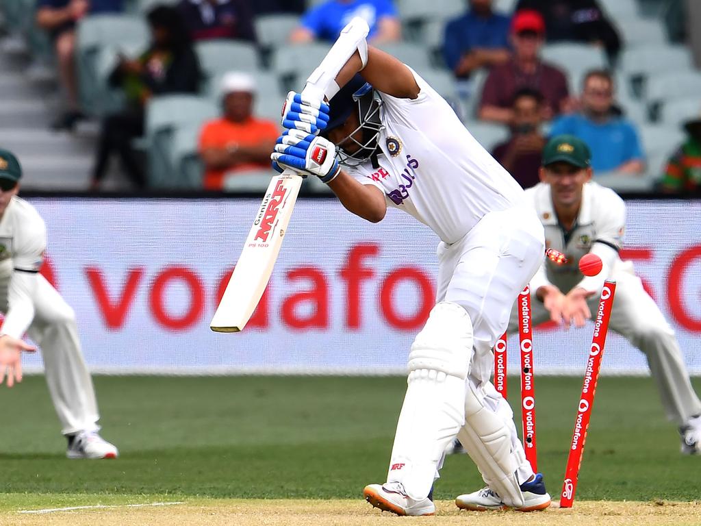 India's batsman Prithvi Shaw is clean bowled by Australia's paceman Mitchell Starc.