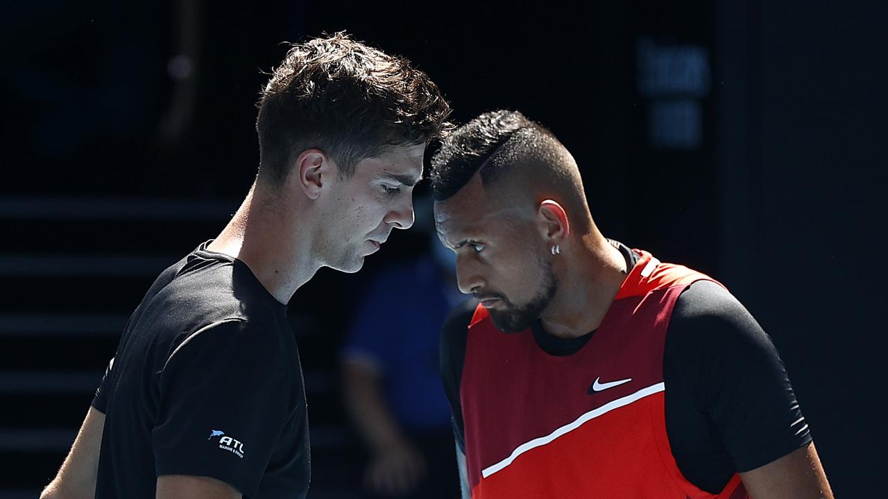 MELBOURNE, AUSTRALIA - JANUARY 27: Nick Kyrgios and Thanasi Kokkinakis of Australia discuss tactics in their Men's Doubles Semifinals match against Marcel Granollers of Spain and Horacio Zeballos of Argentina during day 11 of the 2022 Australian Open at Melbourne Park on January 27, 2022 in Melbourne, Australia. (Photo by Darrian Traynor/Getty Images)