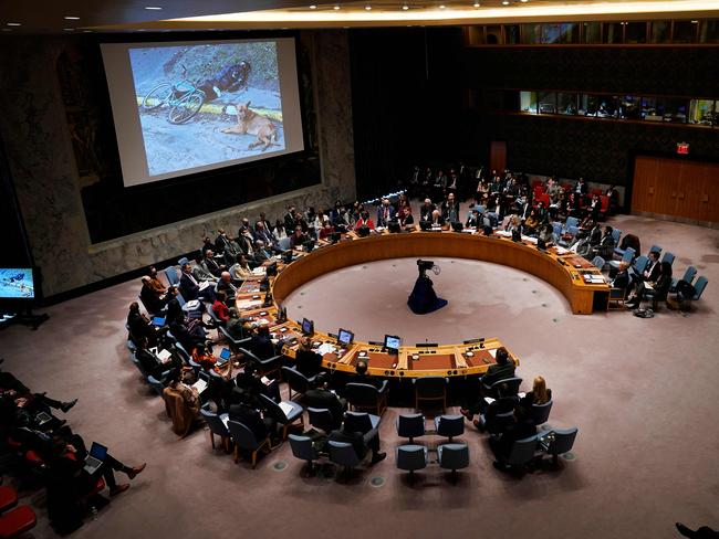 Photos of dead bodies in Ukraine are shown on a screen as Ukrainian President Volodymyr Zelenskyy addresses the United Nations Security Council in New York City. Picture: AFP