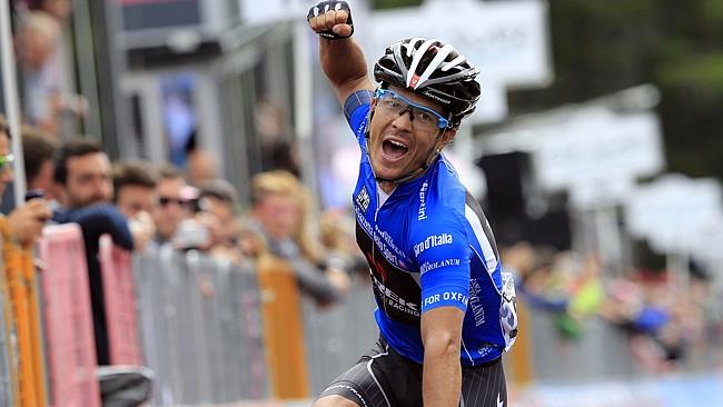 Colombian Julian Arredondo celebrates as he crosses the finish line of the 18th stage of 