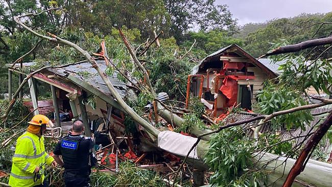 A large gum tree crashed into a Currumbin Valley, Gold Coast, home on Friday due to strong winds ahead of Tropical Cyclone Alfred. Picture: Queensland Ambulance Service/Facebook