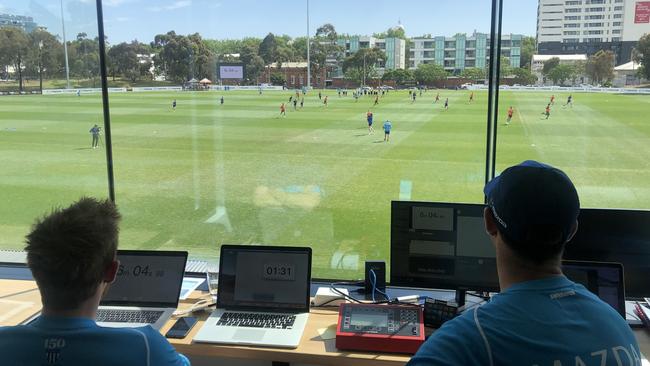 Assistant coach Jade Rawlings (right) and clips up pieces of training as the Kangaroos raise the bar with their player education. Pic: Jay Town