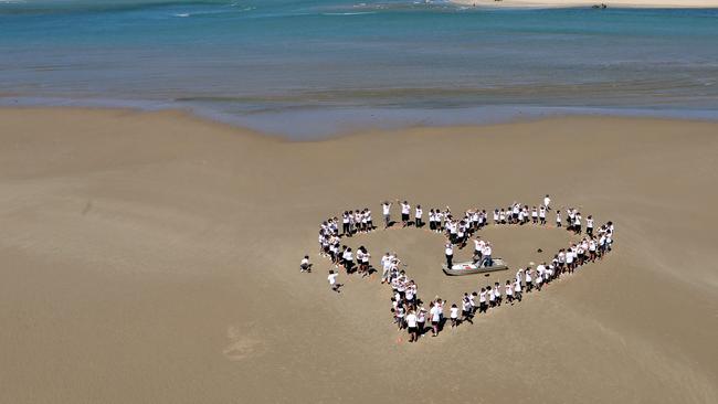 Local school children form heart shape at the Murray River mouth, Goolwa.