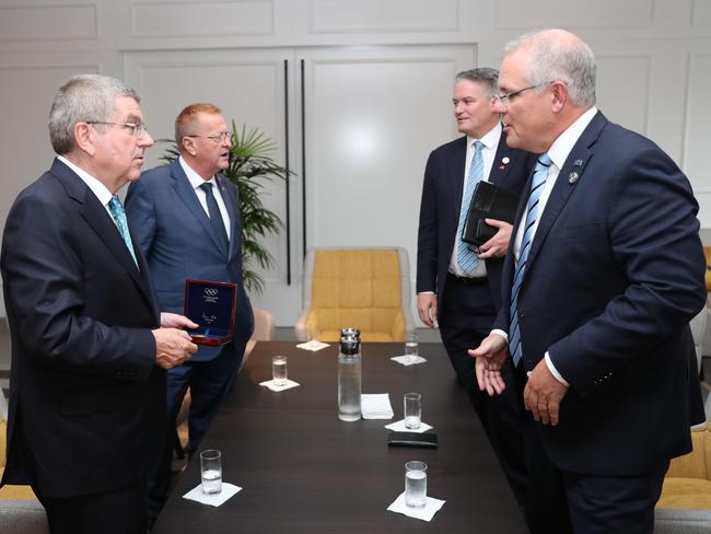 IOC President Thomas Bach and Vice President John Coates with Mathias Cormann and Prime Minister Scott Morrison.