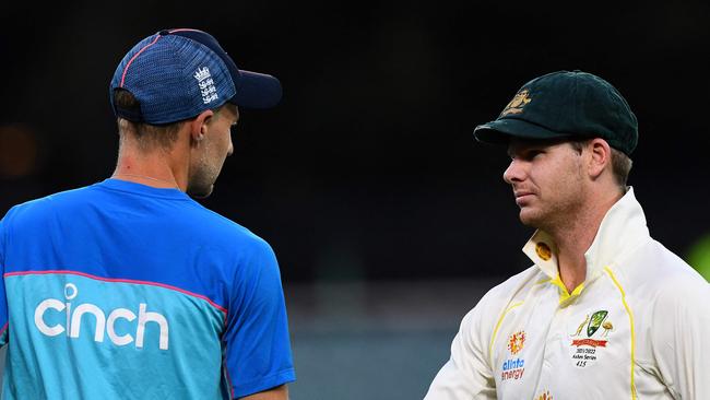 Smith shakes hands with England captain Joe Root after the comprehensive win. Picture: AFP