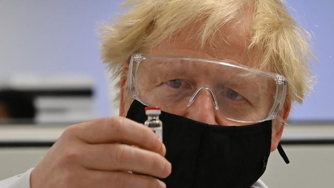 Boris Johnson with a vial of the AstraZeneca/Oxford University COVID-19 candidate vaccine, known as AZD1222. Picture: Getty Images.