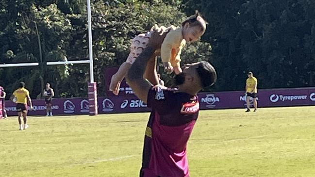 Payne Haas having fun with his daughter at Broncos training.