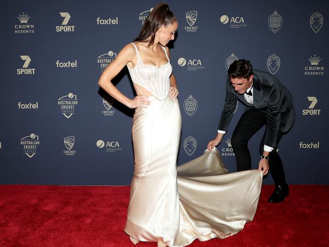 Pat Cummins helps fiance Becky Boston arrive on the red carpet. Picture: Getty Images