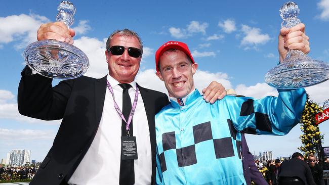 Trainer Darren Weir and Jockey John Allen celebrate Extra Brut’s win in the Victoria Derby. Picture: Getty Images