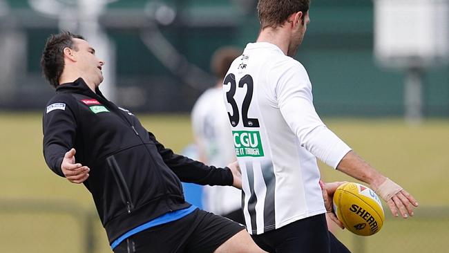 Ben Dixon works with Travis Cloke at Collingwood training. Picture: Michael Klein