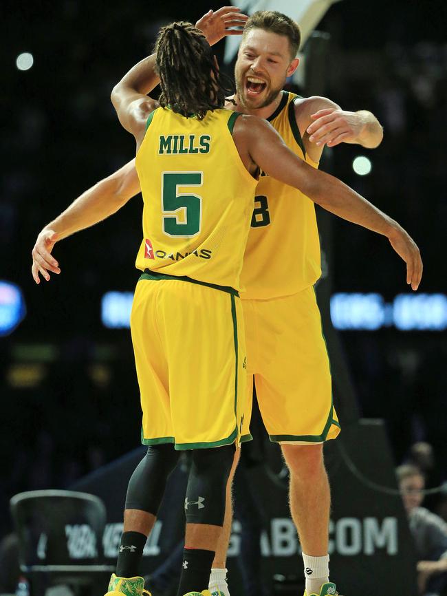 Patty Mills and Matthew Dellavedova of the Boomers celebrate victory. Picture: Mark Stewart