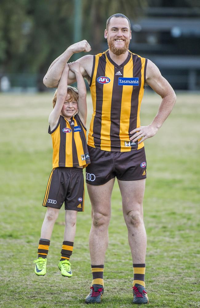 Flynn, 8, with Jarryd Roughead. Picture: Jason Edwards