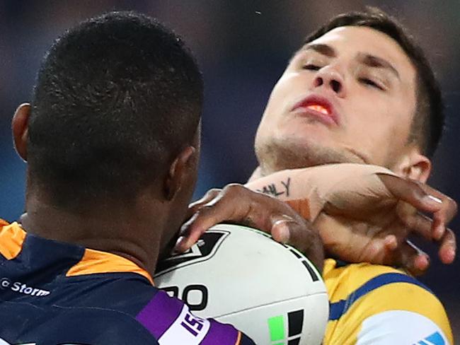 MELBOURNE, AUSTRALIA - SEPTEMBER 21: Mitchell Moses of the Eels is tackled by Suliasi Vunivalu of the Storm during the NRL Semi Final match between the Melbourne Storm and the Parramatta Eels at AAMI Park on September 21, 2019 in Melbourne, Australia. (Photo by Kelly Defina/Getty Images)