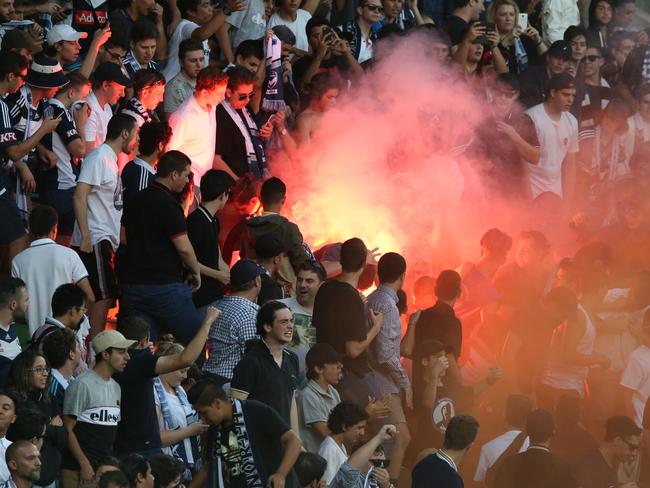 Victory fans set off a flare during the Melbourne Victory v Melbourne City A League game at AAMI Stadium. Saturday, Feb 13. 2015. Picture: David Crosling