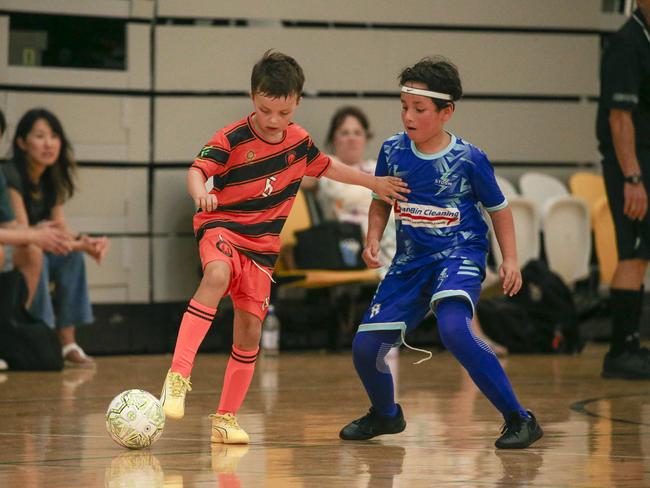 Sam Corbett (L) and Julian Padayachey as Storm FC V Galaxy FC at the Gold Coast International Futsal Championships  at Carrara.Picture: Glenn Campbell