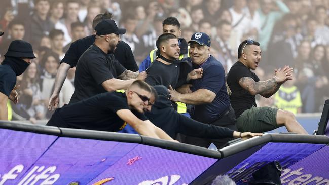 Fans storm the pitch in protest during the Melbourne City v Melbourne Victory match at AAMI Park. Picture: Darrian Traynor/Getty Images