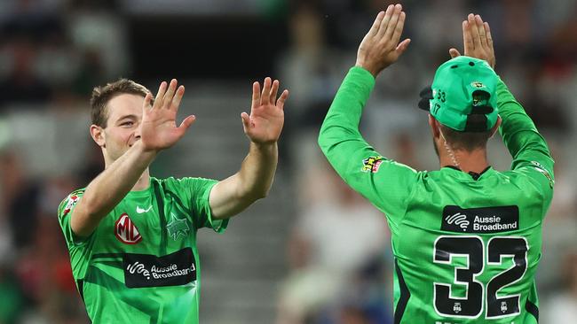 Brody Couch celebrates a wicket with Melbourne Stars teammate Glenn Maxwell at the MCG in January, 2022. Picture: Mike Owen/Getty Images