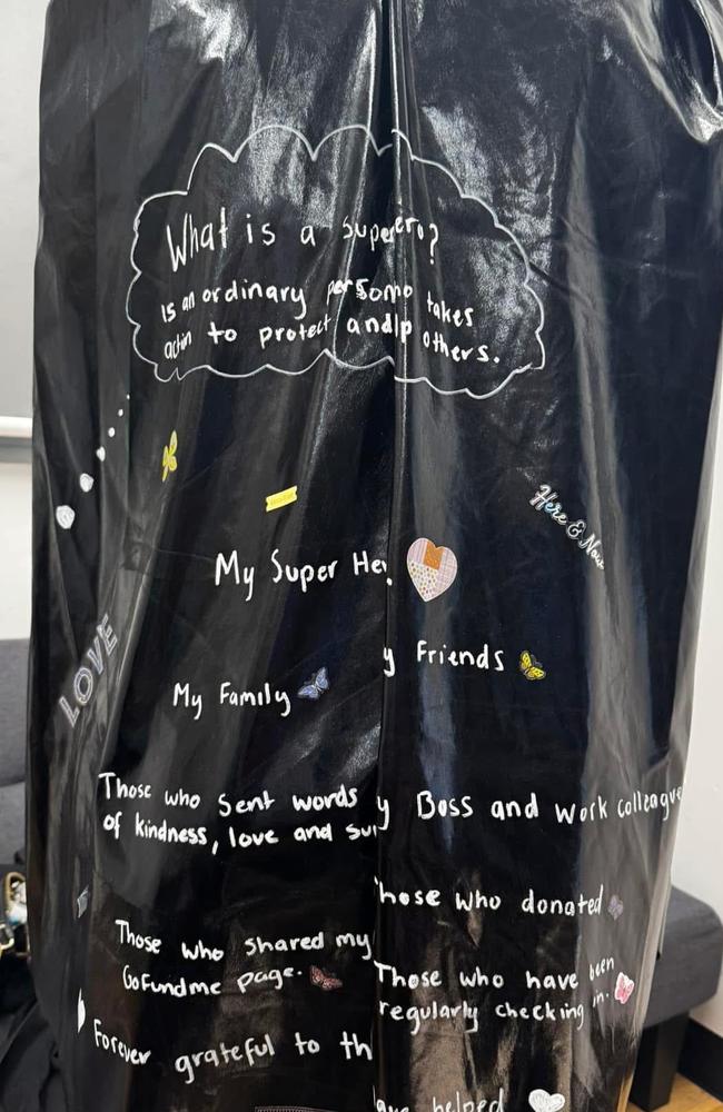 Tahlia's cape with her superheroes mentioned in white writing. Picture: Tahlia Colbert / Supplied.