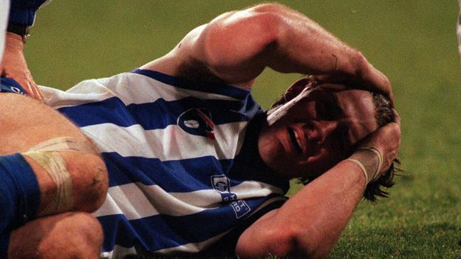 McKernan after breaking his leg in a game against the Brisbane Lions.