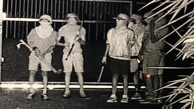 ‘Like a scene out of a war zone’ ... six youths have been caught on camera wandering around a suburban backyard armed with makeshift weapons in the dead of night. Photo: Facebook