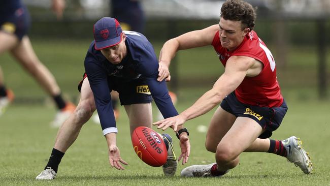 Lachie Hunter of the Demons and Daniel Turner of the Demons in action during a Melbourne Demons training session at Gosch's Paddock on December 14, 2022 in Melbourne.