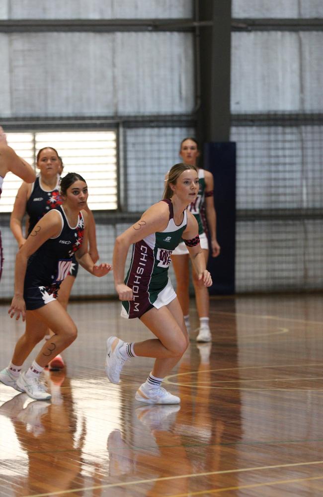 Netball action from QISSN 2024, Townsville. Chisholm Catholic College Cornubia v Aquinas College Ashmore