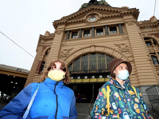 People wearing masks outside Flinders Street Station. Melbourne. Picture: NCA NewsWire / Andrew Henshaw.