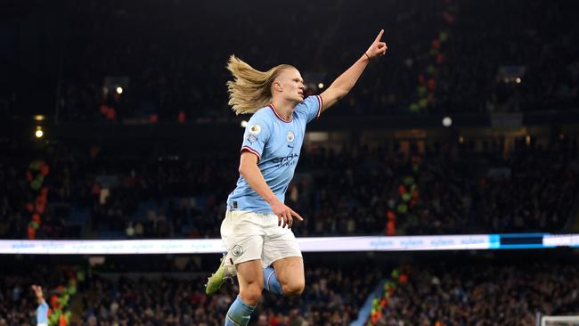 MANCHESTER, ENGLAND - APRIL 26: Erling Haaland of Manchester City celebrates after scoring the team's fourth goal during the Premier League match between Manchester City and Arsenal FC at Etihad Stadium on April 26, 2023 in Manchester, England. (Photo by Catherine Ivill/Getty Images)