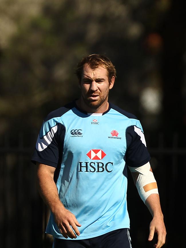 Rocky Elsom looks on during a Waratahs Super Rugby training session at Moore Park in 2012. Photo: Mark Metcalfe