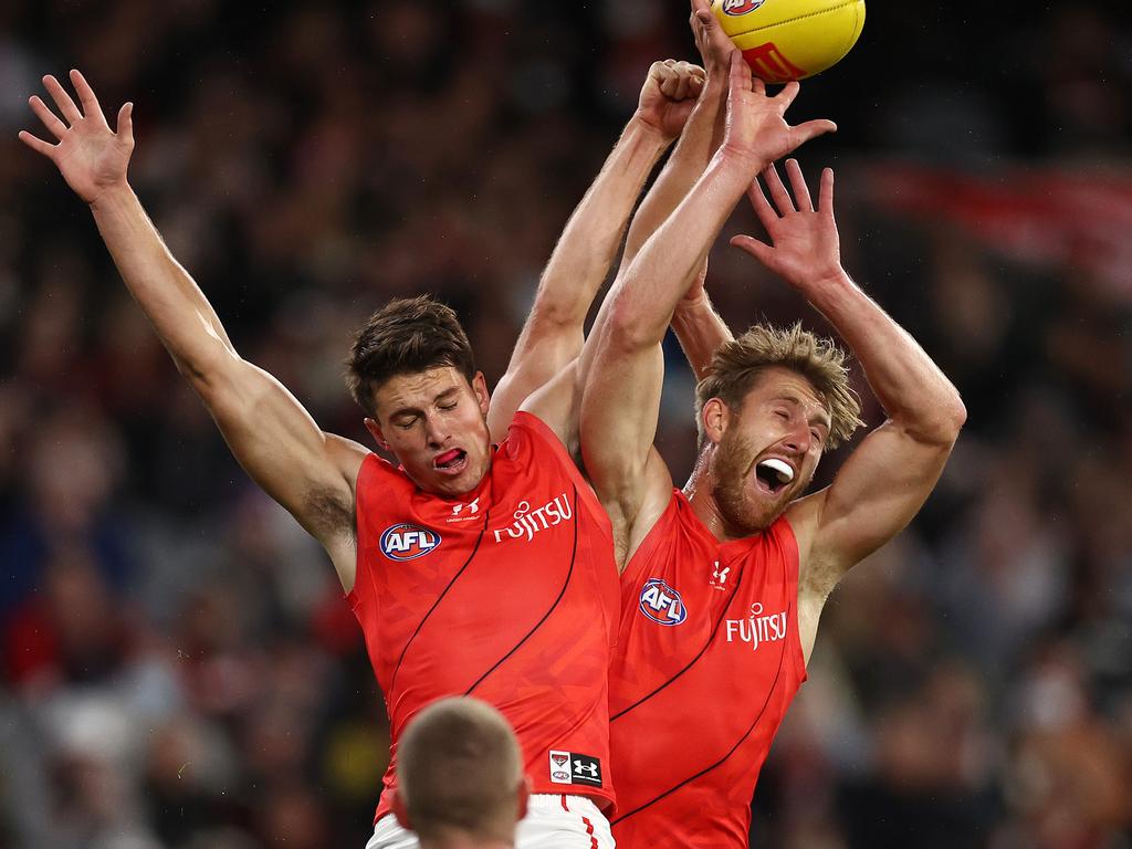 Dyson Heppell (right) flies for a mark on Saturday night. Picture: Michael Klein