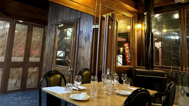 Dark wood dominates this dining space at Fire and Vine restaurant, Glenunga.